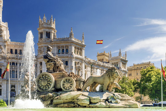 Fountain of Cibeles in Madrid with Spanish flag flying